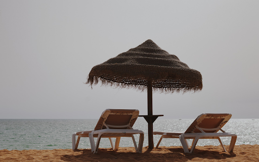Tasseled umbrella on the beach  from Chrome web store to be run with OffiDocs Chromium online
