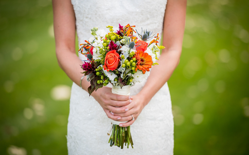 The bride holds a bouquet of flowers  from Chrome web store to be run with OffiDocs Chromium online