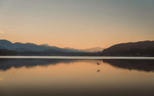 Tranquil Sunset Over Mountain Lake  from Chrome web store to be run with OffiDocs Chromium online