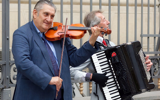 Two men performing on the street  from Chrome web store to be run with OffiDocs Chromium online