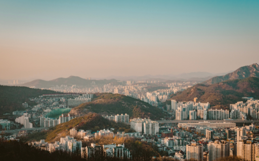 Urban Sprawl Amidst Mountainous Terrain  from Chrome web store to be run with OffiDocs Chromium online