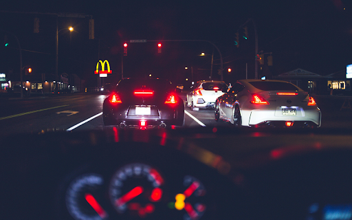 Various modern vehicles riding on street at night  from Chrome web store to be run with OffiDocs Chromium online