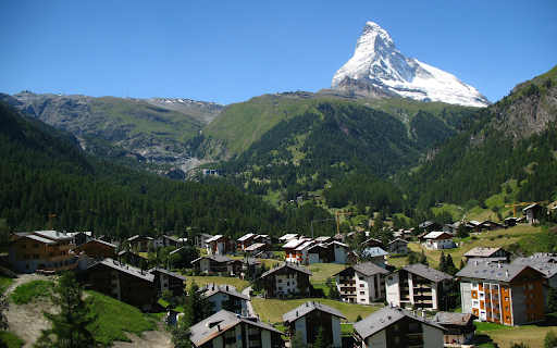 Village in the middle of green mountains  from Chrome web store to be run with OffiDocs Chromium online