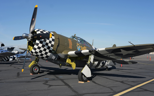 Vintage P 47 Thunderbolt on Airport Tarmac  from Chrome web store to be run with OffiDocs Chromium online