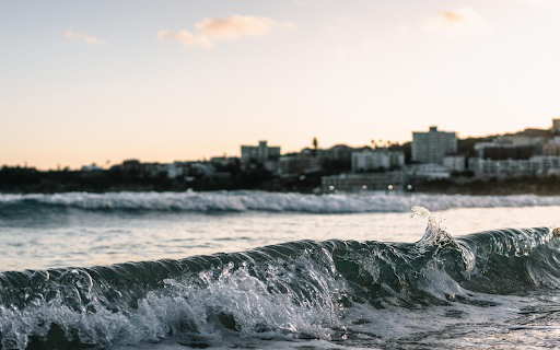Waves roll onto the shore  from Chrome web store to be run with OffiDocs Chromium online