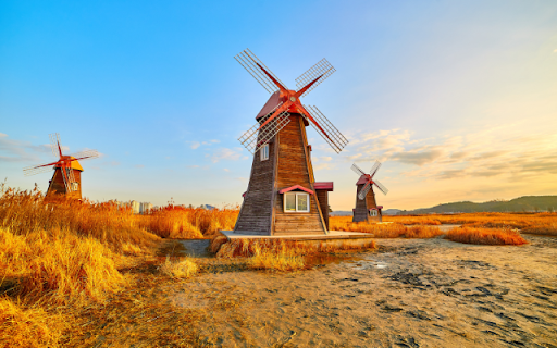 Whimsical Windmills in a Golden Landscape  from Chrome web store to be run with OffiDocs Chromium online