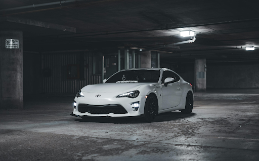 White Toyota Sports Car Parked in an Underground Parking Lot  from Chrome web store to be run with OffiDocs Chromium online