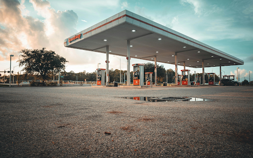 Wide Angle Shot of a Modern Gas Station at Dusk  from Chrome web store to be run with OffiDocs Chromium online
