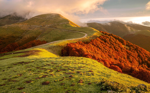 Winding Road Through Autumn Hills  from Chrome web store to be run with OffiDocs Chromium online