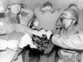 Free download Soldiers Cut A Students Hair After He Was Arrested During The First Hour And A Half Of Shooting In The Tlatelolco Area In Mexico City On October 3, 1968. free photo or picture to be edited with GIMP online image editor