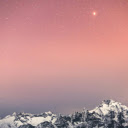 starry sky transitioning into a pink sunset over snow capped  screen for extension Chrome web store in OffiDocs Chromium