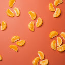 Tangerine Slices on a Red Background  screen for extension Chrome web store in OffiDocs Chromium