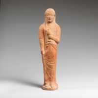 Free download Terracotta statuette of a woman holding a bird free photo or picture to be edited with GIMP online image editor