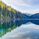 tranquil lake mirroring the enchanting silhouettes  screen for extension Chrome web store in OffiDocs Chromium