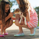Two girls holding dogs  screen for extension Chrome web store in OffiDocs Chromium