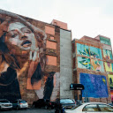 Vehicles Park Near Wall With Woman Graffiti  screen for extension Chrome web store in OffiDocs Chromium