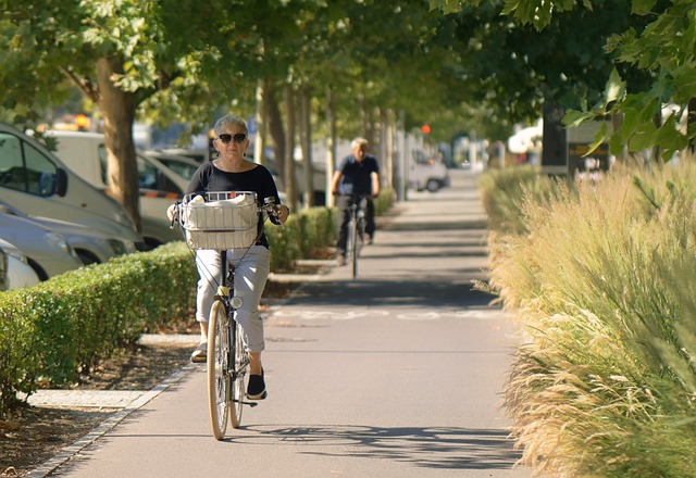 Free download woman old cycling the sidewalk free picture to be edited with GIMP free online image editor
