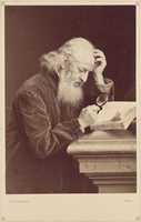 Free download [Bearded Man with Magnifying Glass Examining a Manuscript] free photo or picture to be edited with GIMP online image editor