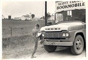 Free download [Boy reading with foot on Bookmobile] free photo or picture to be edited with GIMP online image editor
