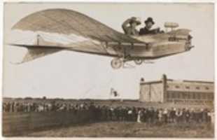 Free download [Couple Flying Airplane Over Crowd] free photo or picture to be edited with GIMP online image editor