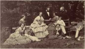 Free download [Group Portrait of Four Women, Two Men and Three Children in a Garden] free photo or picture to be edited with GIMP online image editor