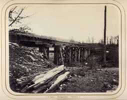 Free download [Winter Scene with Trestle Bridge Along the Atlantic & Great Western Railway] free photo or picture to be edited with GIMP online image editor