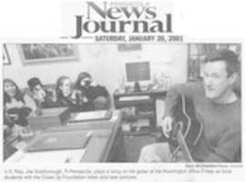Free download 1.1.2001 U.S. Rep Joe Scarborough plays songs for teen girls at his Washington office. free photo or picture to be edited with GIMP online image editor