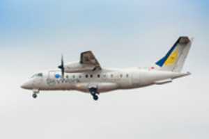 Free download 20.2.2017 / HB-AEY /  SkyWork Airlines / Dornier 328-130 / landing at Vienna airport free photo or picture to be edited with GIMP online image editor