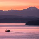 A Boat near a Shore with View of Mountains at Sunset  screen for extension Chrome web store in OffiDocs Chromium