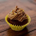 A brownie with nuts and pecans on a wooden table  screen for extension Chrome web store in OffiDocs Chromium