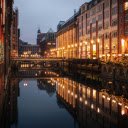 A city with buildings and a canal at night  screen for extension Chrome web store in OffiDocs Chromium