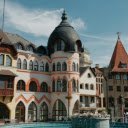 A fountain in front of a building with a clock tower  screen for extension Chrome web store in OffiDocs Chromium