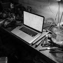 A Grayscale Photo of a Laptop on a Work Table  screen for extension Chrome web store in OffiDocs Chromium