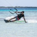A Man Touching the Water while Kitesurfing  screen for extension Chrome web store in OffiDocs Chromium