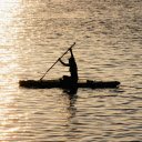 A person paddling in the water at sunset  screen for extension Chrome web store in OffiDocs Chromium