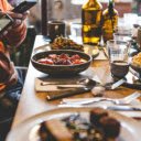 A Person Taking a Picture of Food on a Dining Table  screen for extension Chrome web store in OffiDocs Chromium