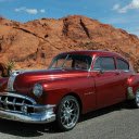 A Red Vintage Car Parked on the Road  screen for extension Chrome web store in OffiDocs Chromium