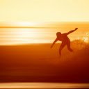 A Silhouette of a Person Surfing during Sunset  screen for extension Chrome web store in OffiDocs Chromium