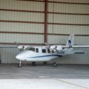 A small airplane parked in a hangar  screen for extension Chrome web store in OffiDocs Chromium
