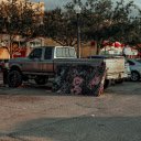 A truck parked in a parking lot with a mattress on the back  screen for extension Chrome web store in OffiDocs Chromium