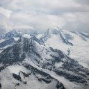 A view of snow covered mountains from an airplane  screen for extension Chrome web store in OffiDocs Chromium