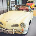 A Vintage Yellow Car in Showroom  screen for extension Chrome web store in OffiDocs Chromium
