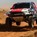 A white car driving on a dirt road  screen for extension Chrome web store in OffiDocs Chromium