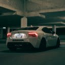 A white sports car parked in a parking garage  screen for extension Chrome web store in OffiDocs Chromium