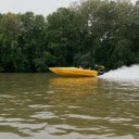 A yellow speed boat is speeding through the water  screen for extension Chrome web store in OffiDocs Chromium