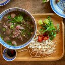 Beef Pho on a Wooden Tray with Garnishes  screen for extension Chrome web store in OffiDocs Chromium