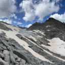 Blue clouds and gray green rocks  screen for extension Chrome web store in OffiDocs Chromium