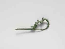 Free download Bronze dragon-type fibula (safety pin) free photo or picture to be edited with GIMP online image editor