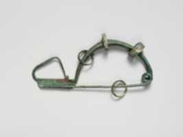 Free download Bronze fibula (safety pin) with four rings free photo or picture to be edited with GIMP online image editor