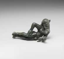 Free download Bronze statuette of a reclining satyr free photo or picture to be edited with GIMP online image editor